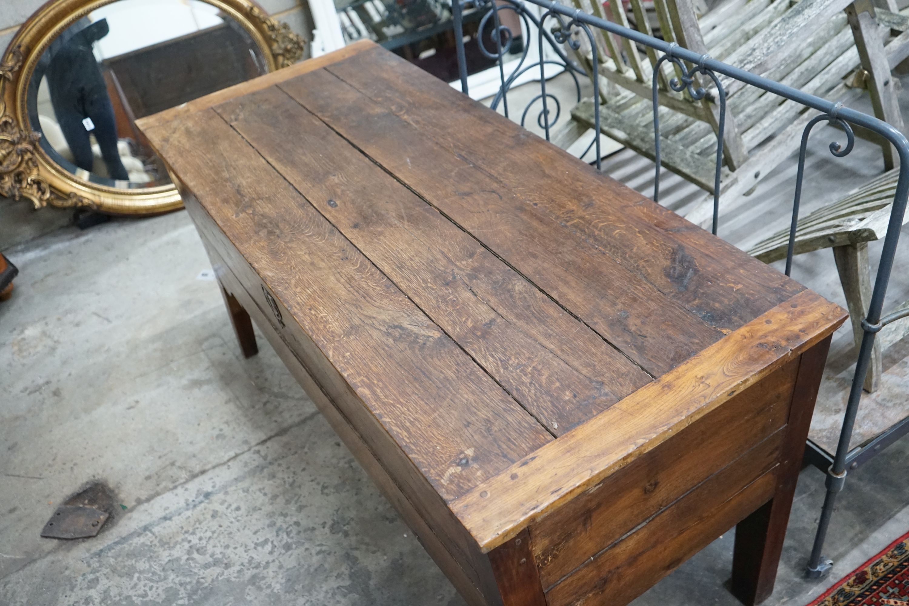 An early 19th century continental oak hinged top dough bin, width 145cm, depth 62cm, height 73cm